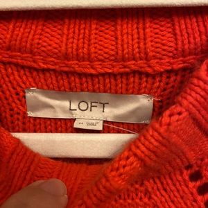 Woman’s red Loft sweater